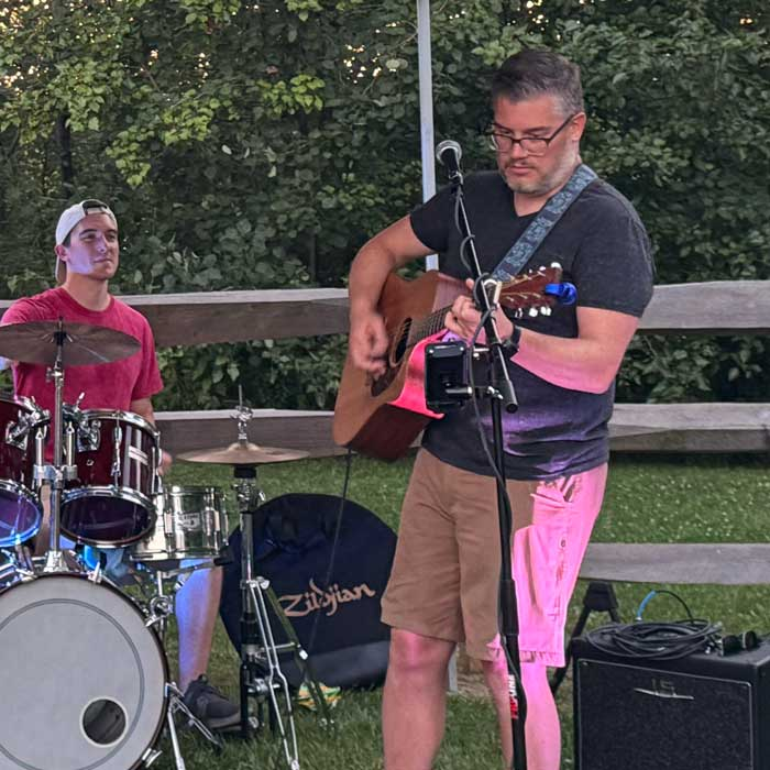 Mike Schell playing guitar